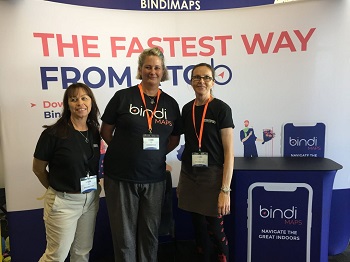 a photo of Kerri, Anna and Kim standing at BindiMaps expo stand