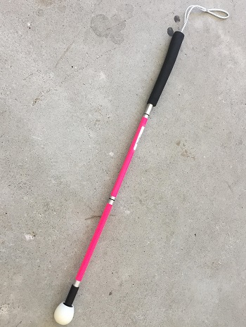 photo of A pink kiddies long cane with raceball tip